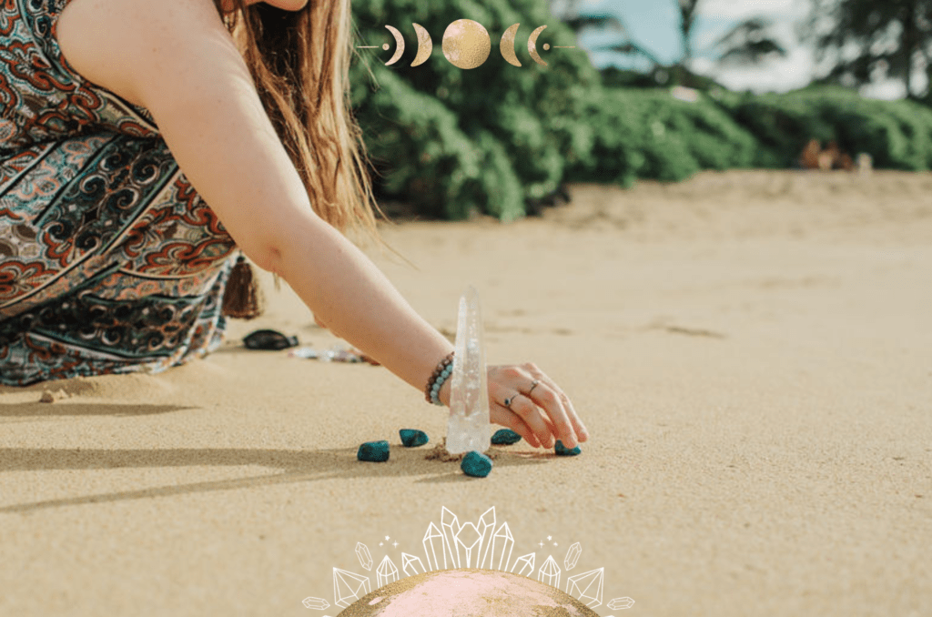 Picture of Ashley on the beach placing crystals around a clear quartz tower
