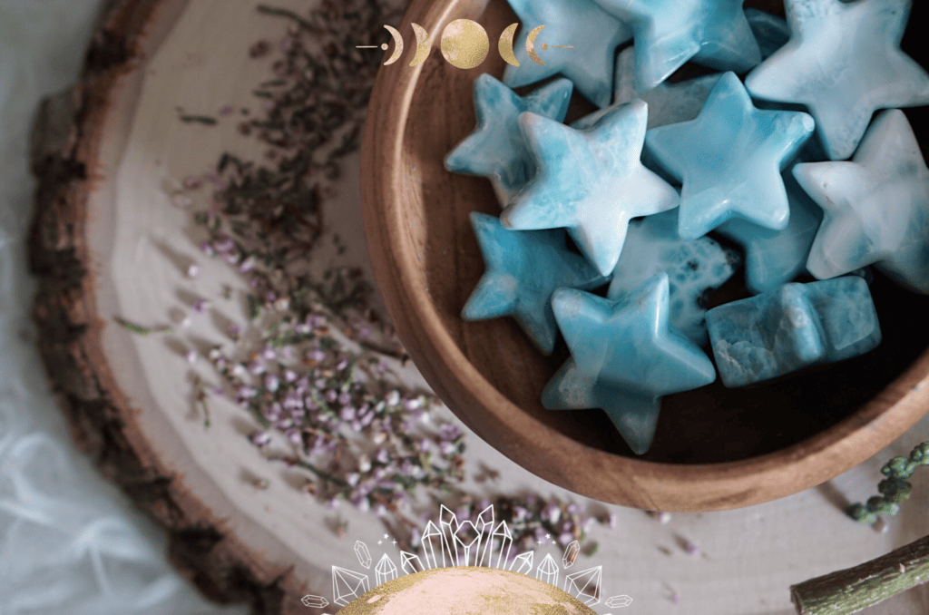 Larimar crystals in the shape of stars in a wood plate